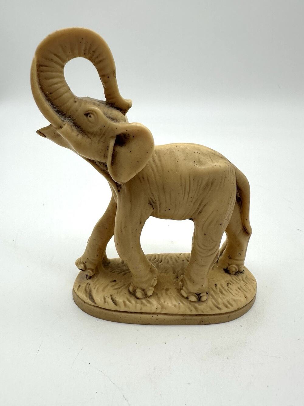 VTG Cream Colored Resin Elephant on Base, Trunk Thrown Over Head Numbered 181